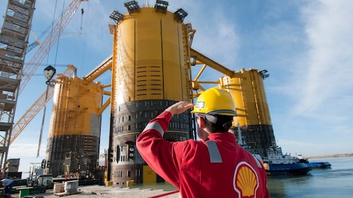 Engineer looking up at platform under construction