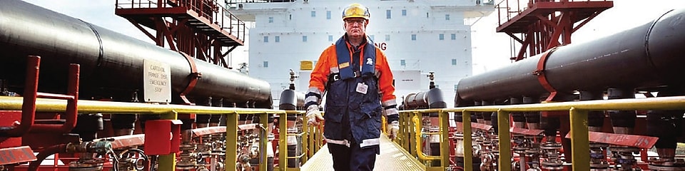 worker walking around a Shell vessel