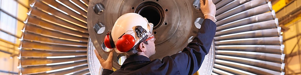 Engineer Inspecting Turbine
