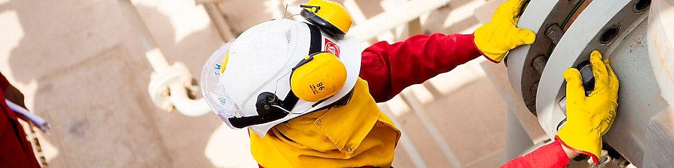 Worker wearing safety mask and gloves