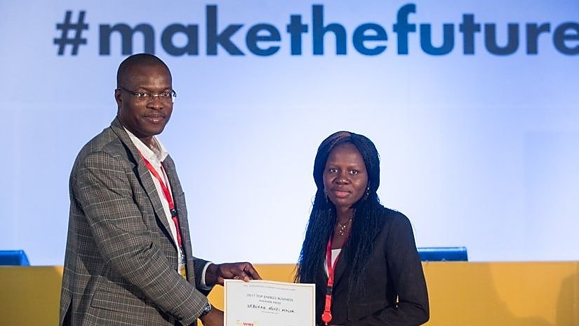 General Manager External Relations of Shell Petroleum Development Company, Mr. Igo Weli, presenting the prize for the best pitch to Mrs. Ngozi Atalor at the Shell LiveWIRE #makethefuture Accelerator event in Port Harcourt.