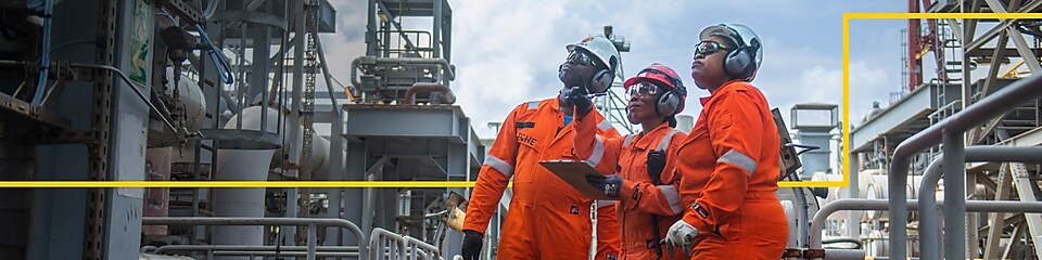 Workers standing in front of SNG gas plant