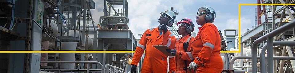 Workers standing in front of SNG gas plant