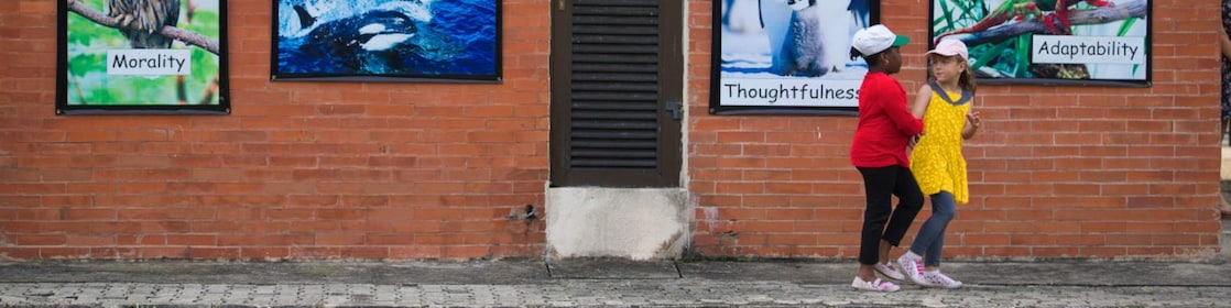Children outside of school building playing